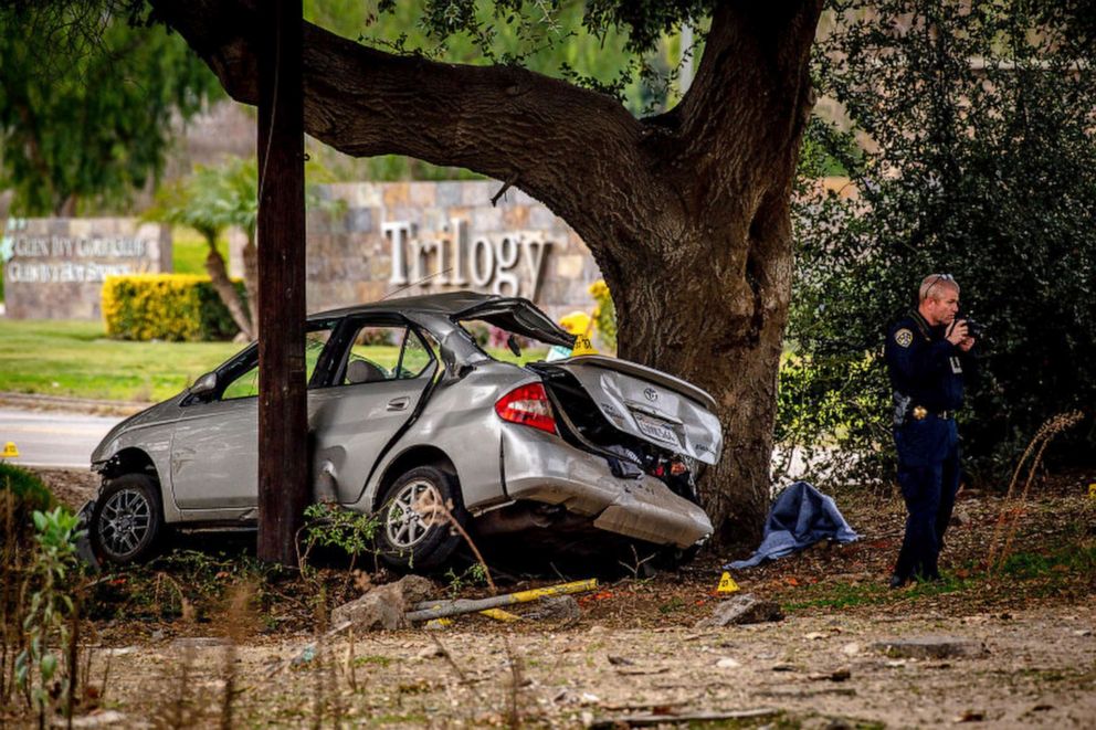 PHOTO: An officer with the California Highway Patrol's Multidisciplinary Accident Investigation Team investigates the scene of a deadly crash in the Temescal Valley, south of Corona, California, on Jan. 20, 2020.