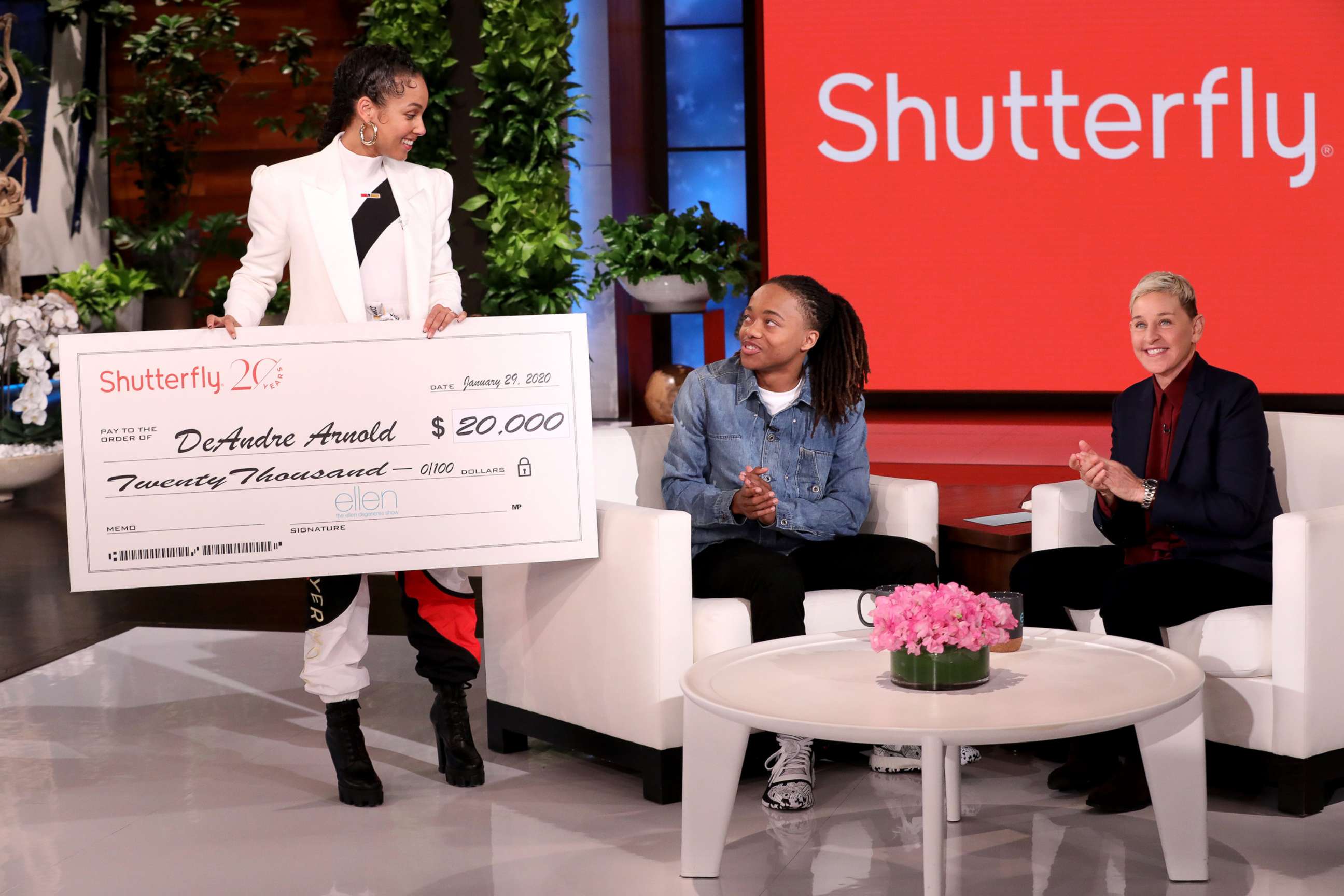 PHOTO: Talk show host Ellen DeGeneres presents a scholarship check to DeAndre Arnold, who made national news after his school told him he couldn’t walk at graduation unless he cut his dreadlocks, Jan. 29, 2020, on "The Ellen DeGeneres Show."