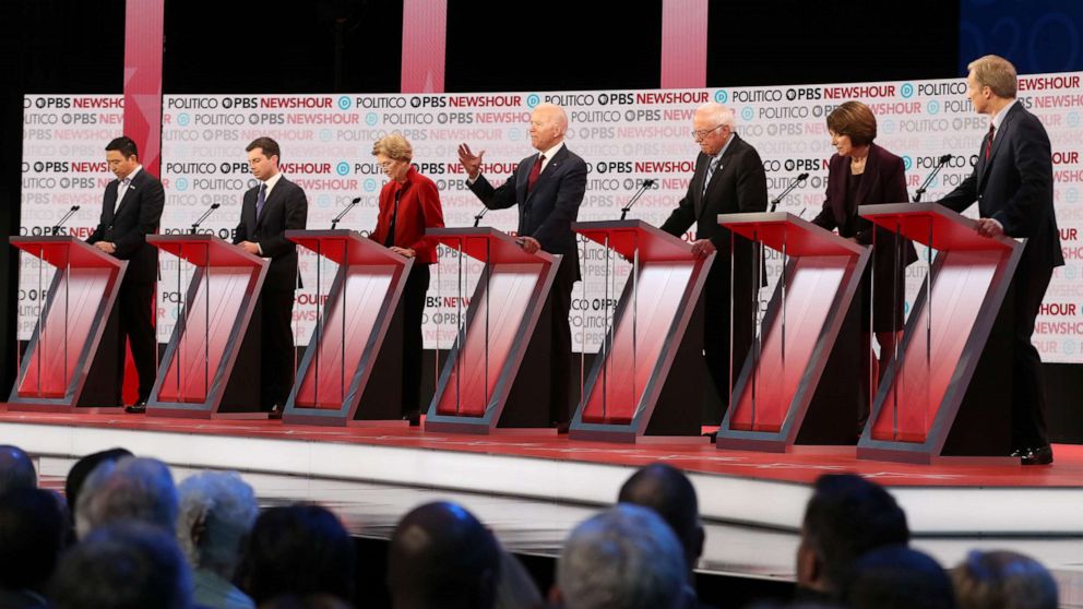 PHOTO: Democratic presidential candidates listen during the Democratic presidential primary debate at Loyola Marymount University on December 19, 2019 in Los Angeles, California.