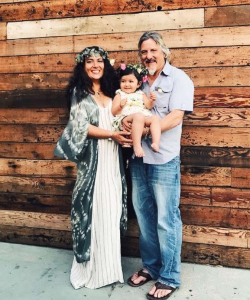 PHOTO: Yvonne DeLaRosa Green and her husband, Sam Boyer, pose with their 2-year-old daughter, Summer Rain. The family lost their home in the Woolsey Fire.