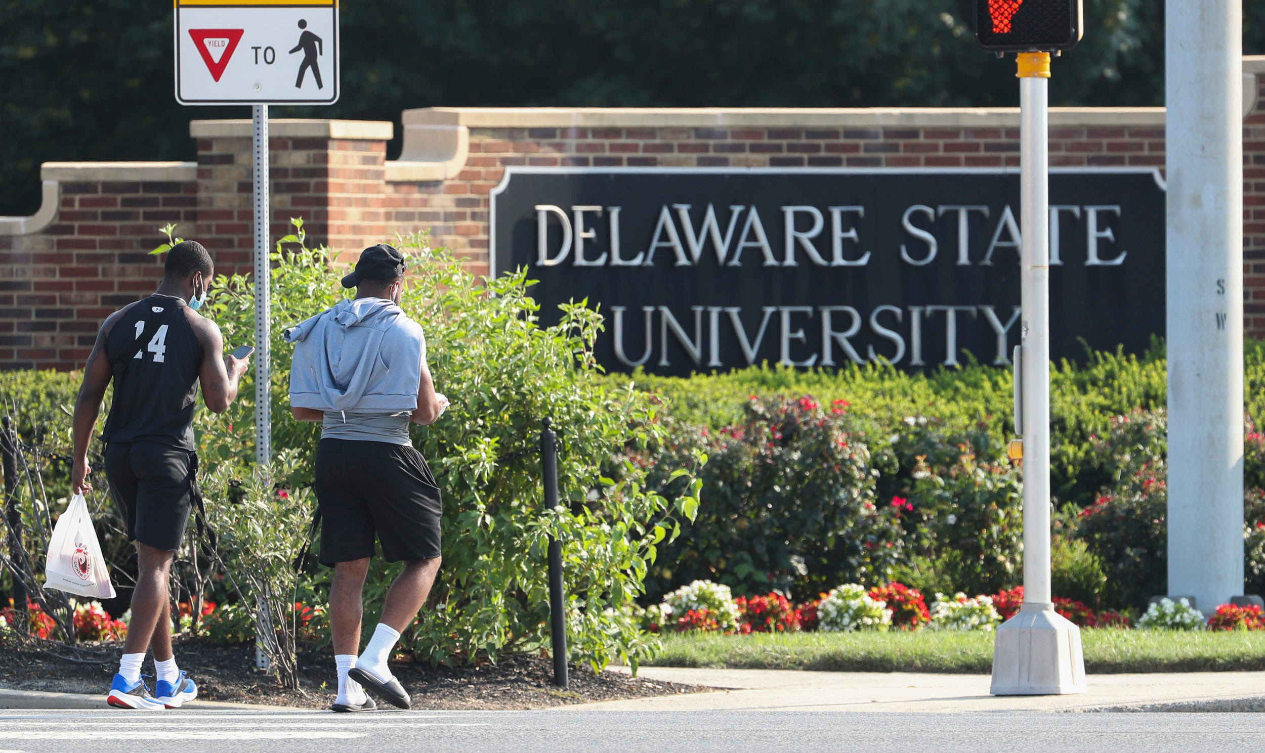 PHOTO: In this July 1, 2021, file photo, Delaware State University students enter the campus in Dover, Md.