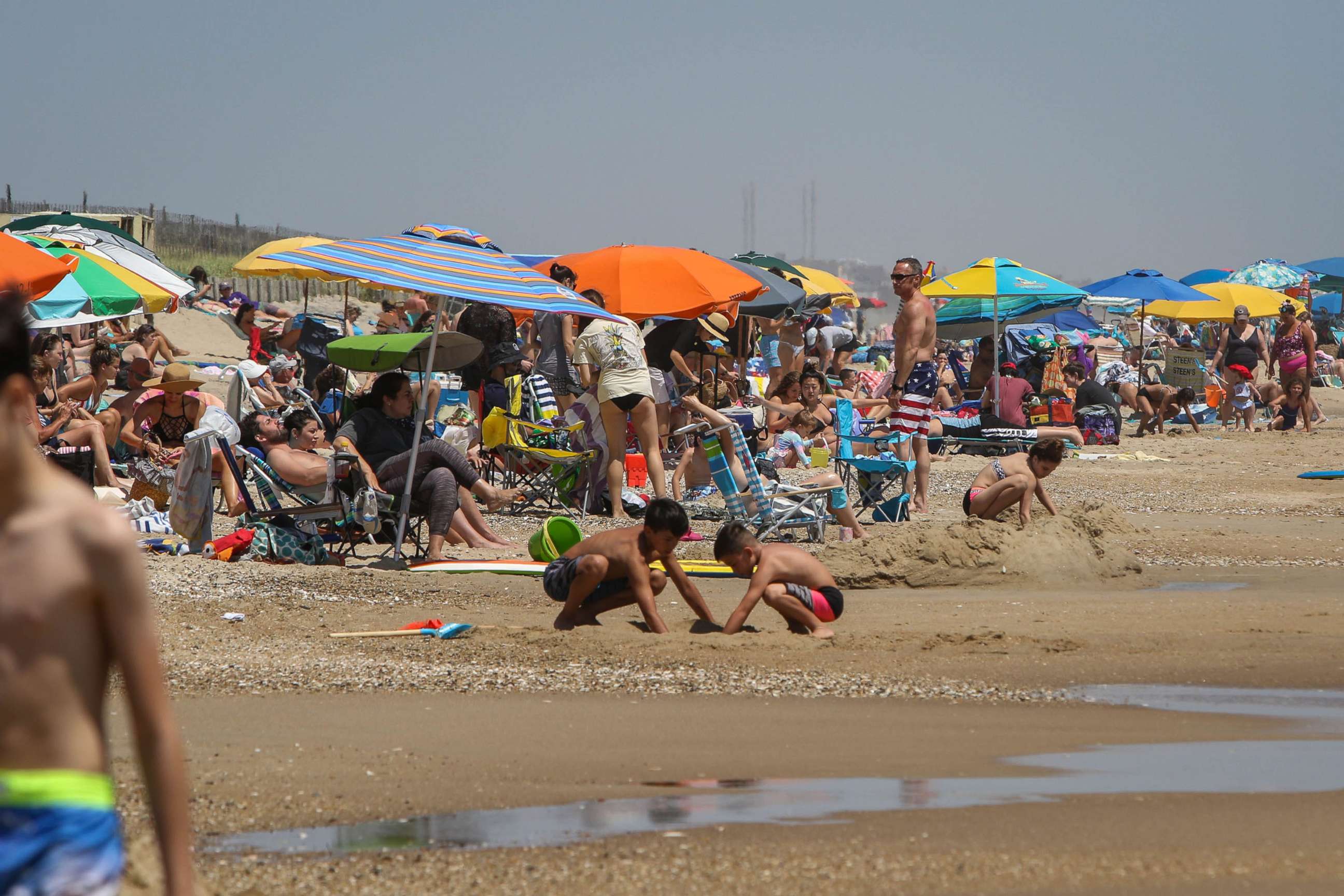 PHOTO: People relax on a beach in Bethany Beach, Del., June 10, 2020. 