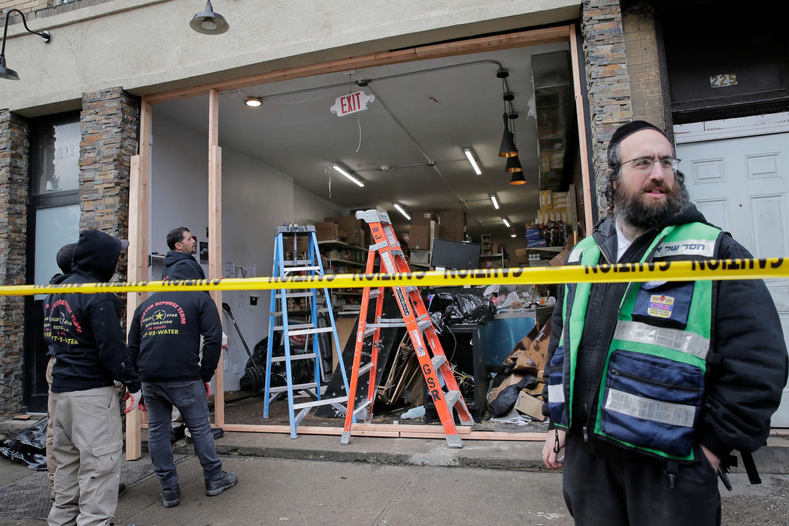 PHOTO:  In this Wednesday, Dec. 11, 2019, file photo, people work to secure the scene of a shooting at a kosher supermarket in Jersey City, N.J. On Friday, Dec. 13, 2019.