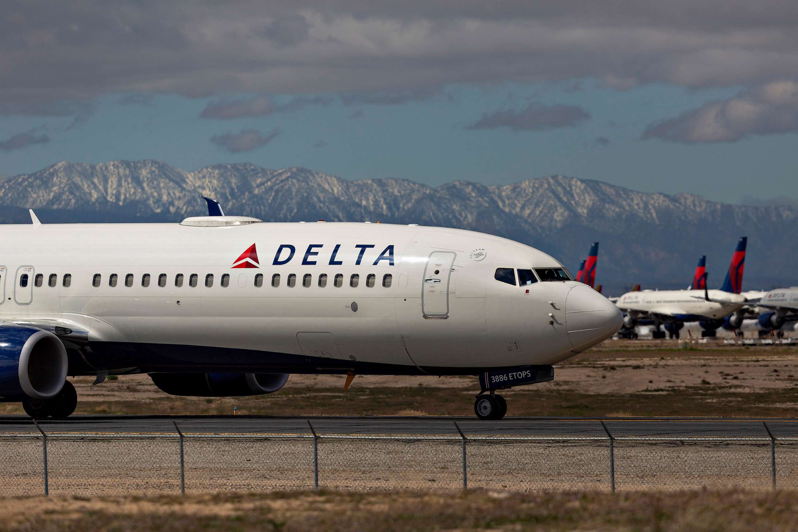 PHOTO: A Delta Air Lines jet taxis to be parked at Southern California Logistics Airport (SCLA) on March 24, 2020, in Victorville, Calif.