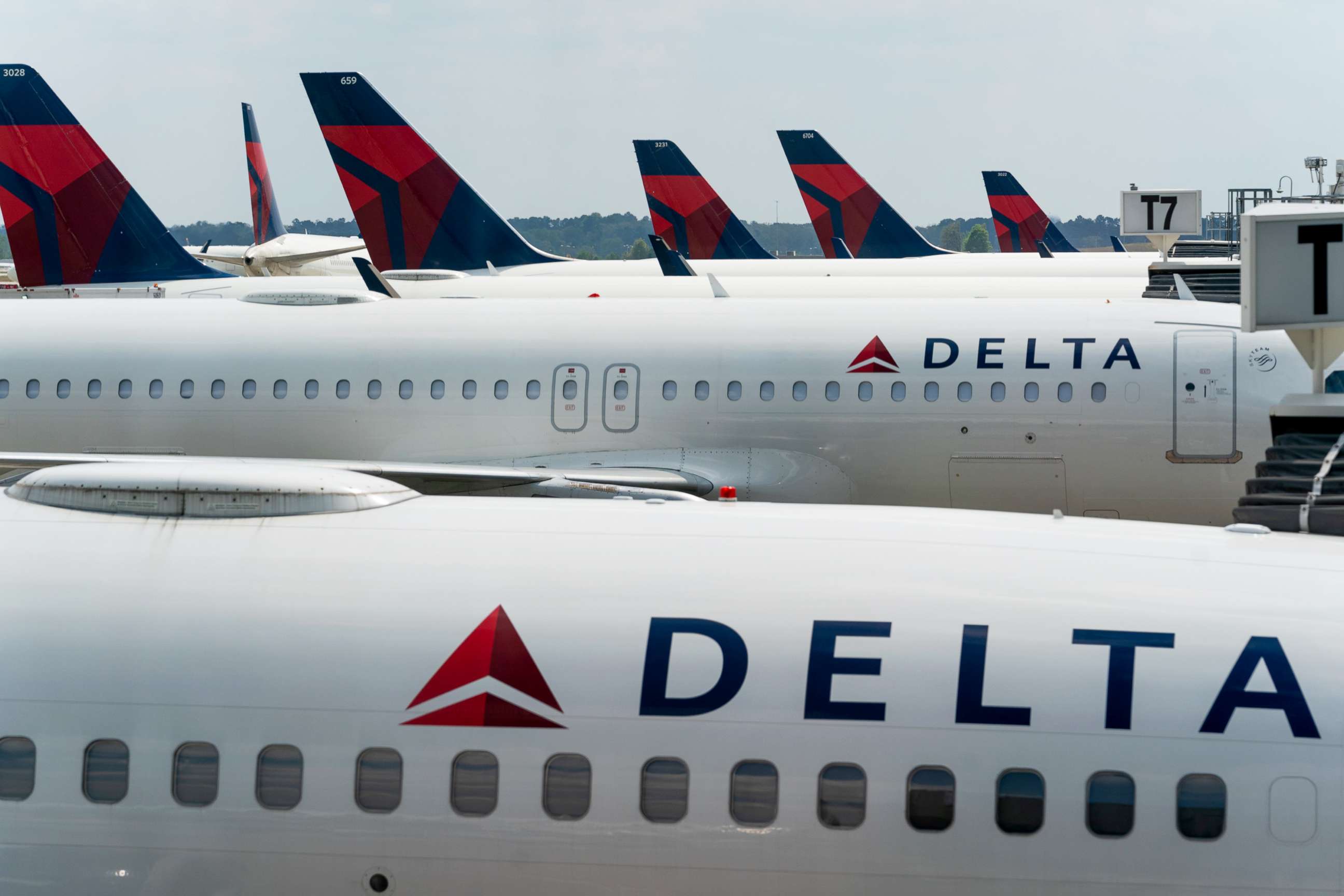 PHOTO: Delta Air Lines planes are parked at gates at Hartsfield-Jackson Atlanta International Airport in Atlanta, April 7, 2021. 