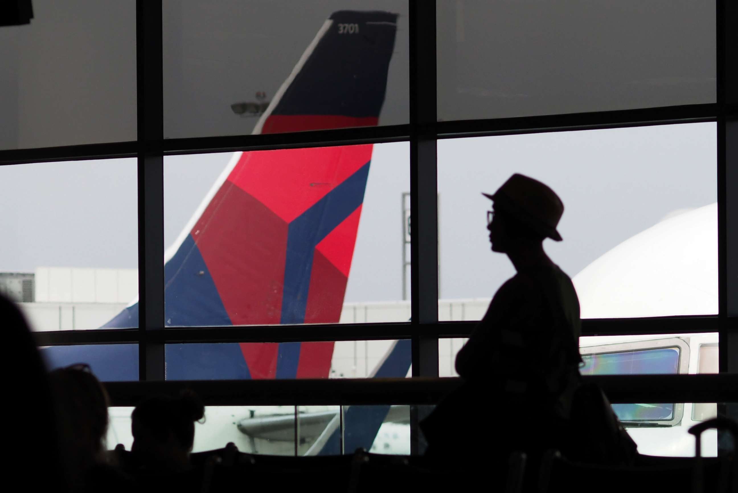 PHOTO: A passengers waits for a Delta Airlines flight in Terminal 5 at Los Angeles International Airport, May 4, 2017, in Los Angeles.