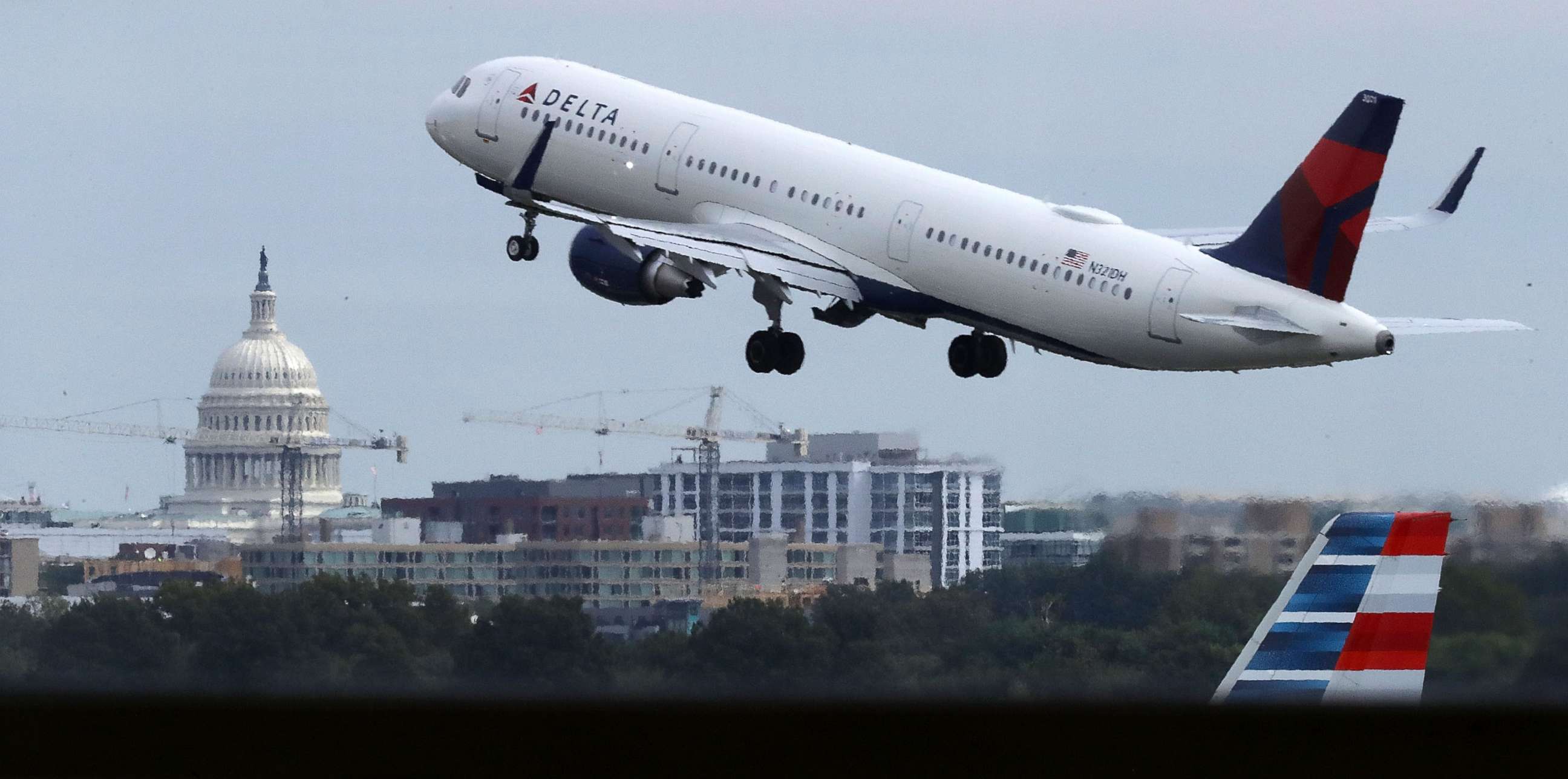 PHOTO: With the U.S. Capitol dome in the distance, a Delta airplane takes off from Ronald Reagan National Airport, Sept. 1, 2017, in Washington, D.C.