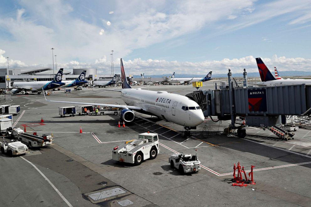 PHOTO: Planes are seen parked at gates at San Francisco International Airport, March 17, 2020.