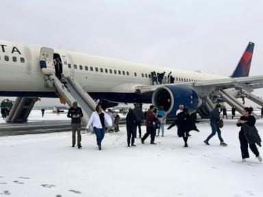 Passengers evacuate plane on slides after Delta flight aborts takeoff