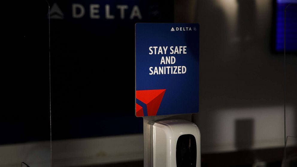 PHOTO: A sanitizer station stands at a Delta Air Lines Inc. passenger check-in counter at Tulsa International Airport in Tulsa, Okla., Oct. 1, 2020.