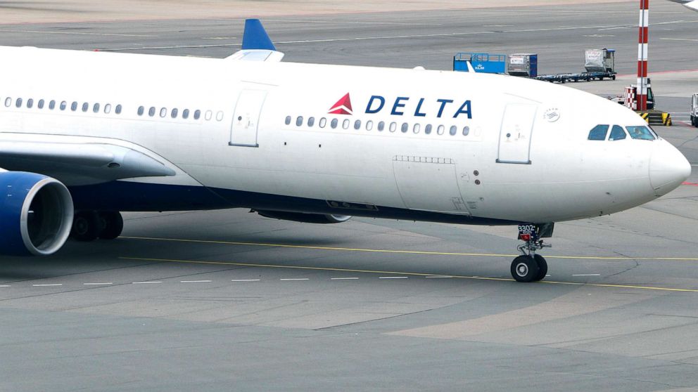 A woman was removed from a Delta flight at the Orlando airport Saturday morning after she entered the plane without a boarding pass, according to authorities.