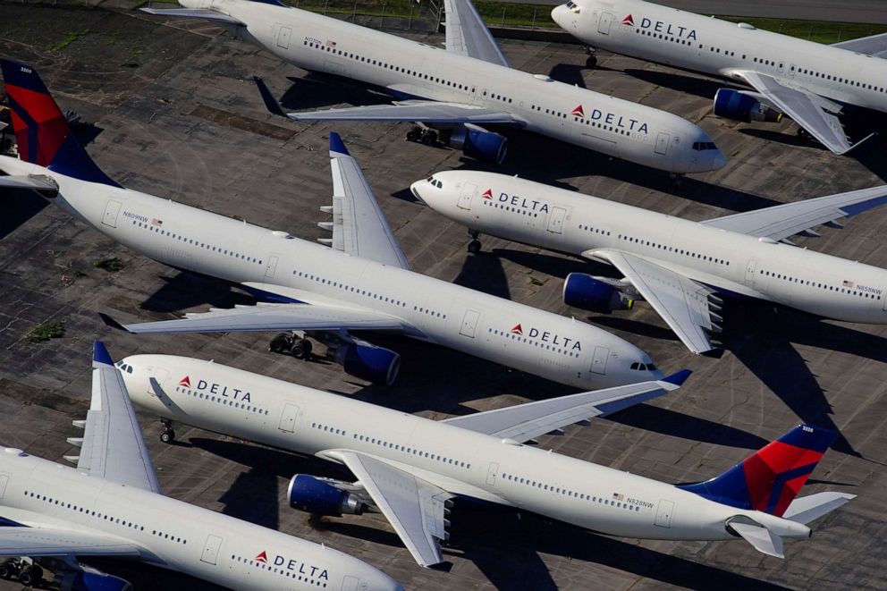 PHOTO: Delta Air Lines passenger planes are seen parked due to flight reductions made to slow the spread of coronavirus disease, at Birmingham-Shuttlesworth International Airport in Birmingham, Ala., March 25, 2020. 