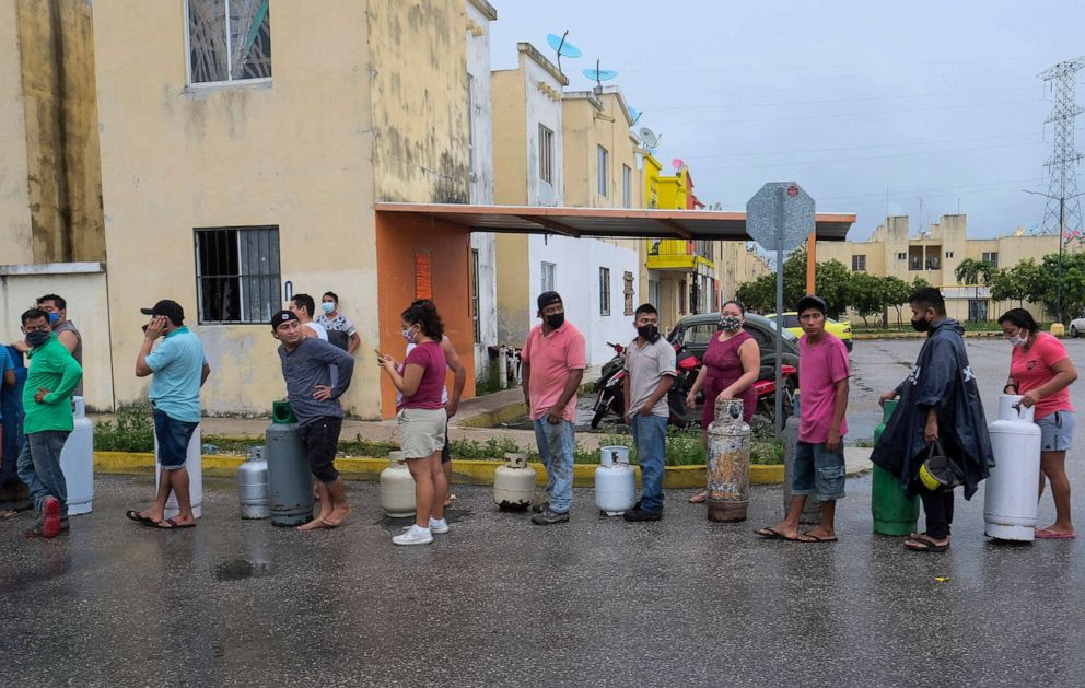 PHOTO: People line up to buy gas prior to the arrival of Hurricane Delta in Cancun, Mexico, Oct. 6, 2020. Delta rapidly intensified into a potentially catastrophic Category 4 hurricane on a course to hit Mexico and continue on to the U.S. Gulf coast. 