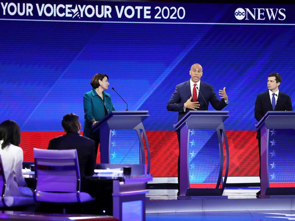 PHOTO: Democratic presidential candidate Sen. Amy Klobuchar and Mayor Pete Buttigieg look on as Sen. Cory Booker speaks during the Democratic Presidential Debate on Sept. 12, 2019, in Houston.