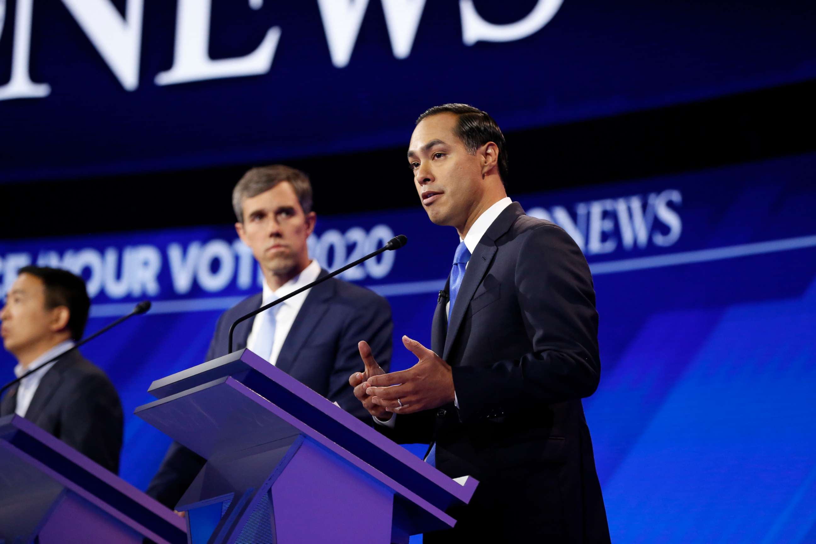 PHOTO: Beto O'Rourke watches while Julian Castro speaks during the third Democratic Primary Debate, in Houston, Sept. 12, 2019.