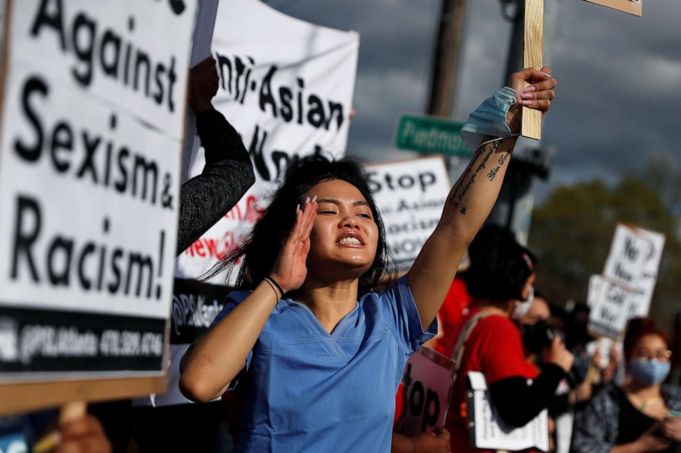 PHOTO: A woman yells during a demonstration following the deadly shootings at three spas in Atlanta, March 18, 2021.