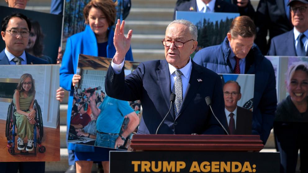 PHOTO: Senate Minority Leader Charles Schumer and fellow Senate Democrats hold photographs of constituents they say are negatively impacted by President Donald Trump's actions during his first month at U.S. Capitol, Mar. 4, 2025 in Washington.