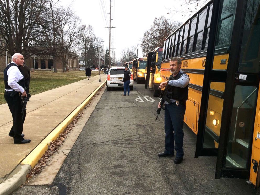 PHOTO: Buses wait to take students to Civic Hall at Richmond High School for parents to pick them up after a report of shots being fired at Dennis Intermediate School in Richmond, Ind., Dec.13, 2018.