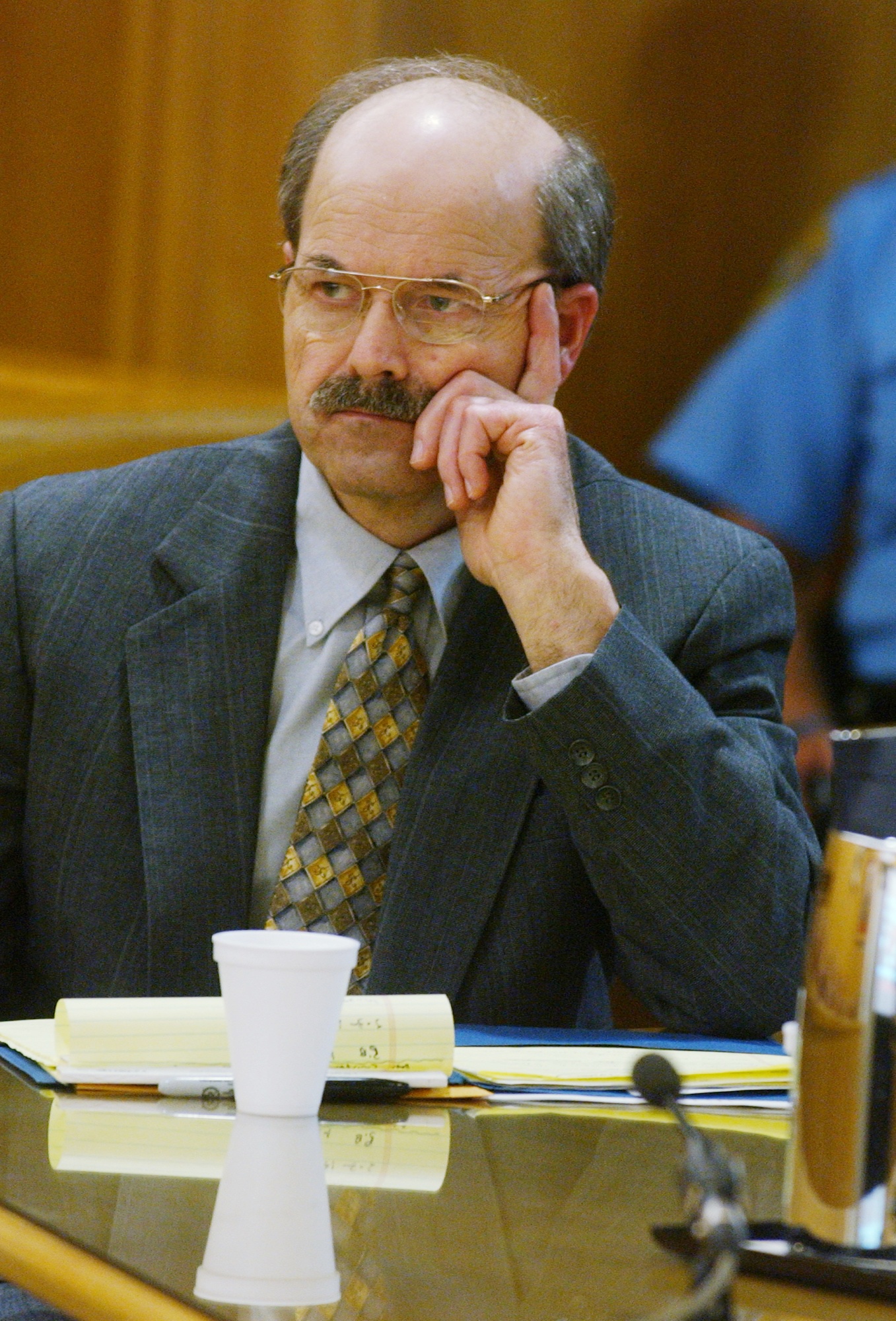PHOTO: BTK serial killer Dennis Rader listens to testimony in the sentencing phase of his trial Wednesday in Sedgwick County Court in Wichita, Kan. Rader is waiting to be sentenced on 10 counts of murder, Aug. 17, 2005.