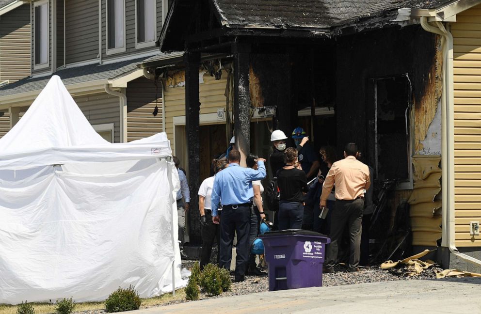 PHOTO: Officials investigate a house fire that killed five people, on Aug. 5, 2020, in Denver.