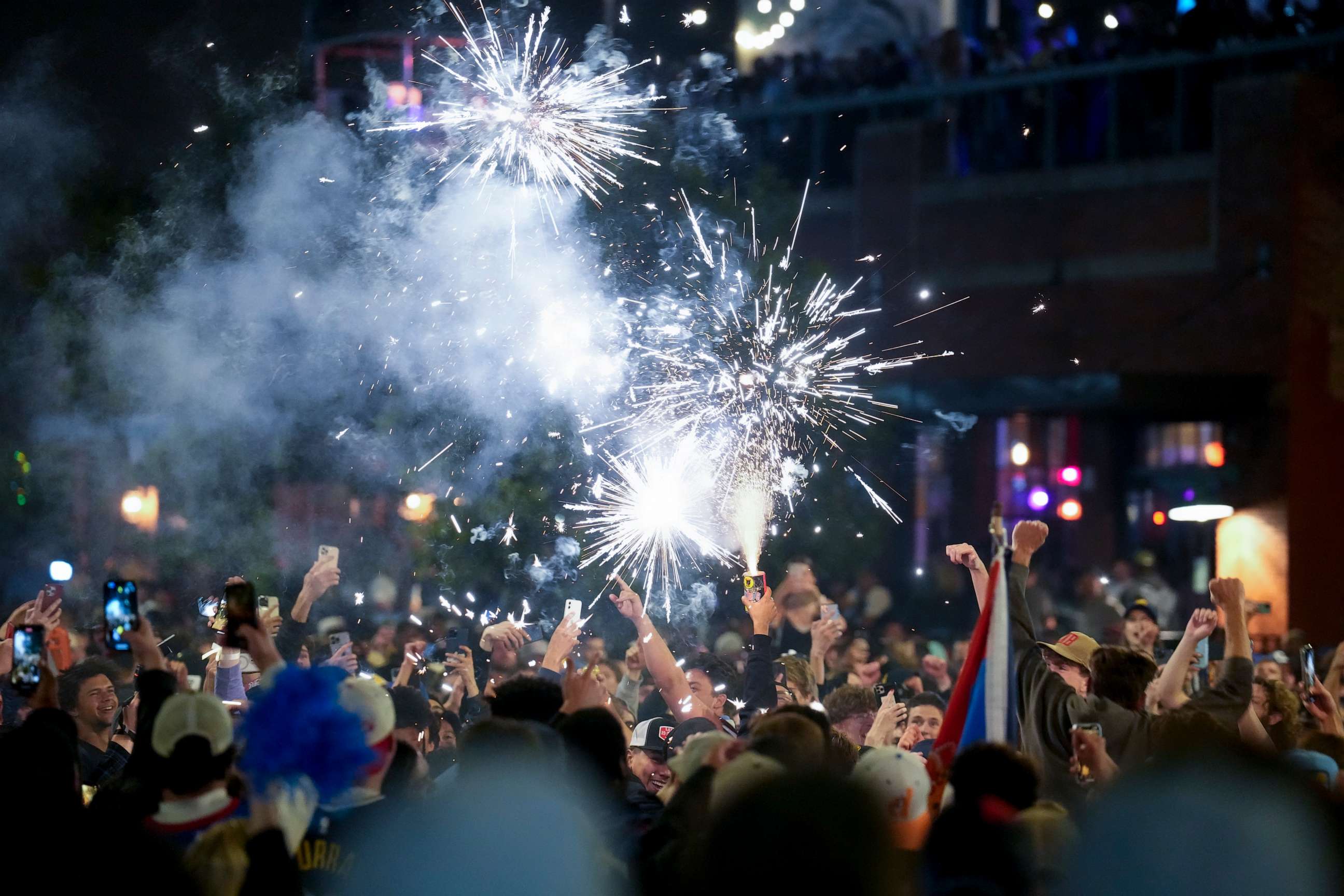 PHOTO: People celebrate after the Denver Nuggets won the NBA Championship with a victory over the Miami Heat in Game 5 of basketball's NBA Finals, Monday, June 12, 2023, in Denver.