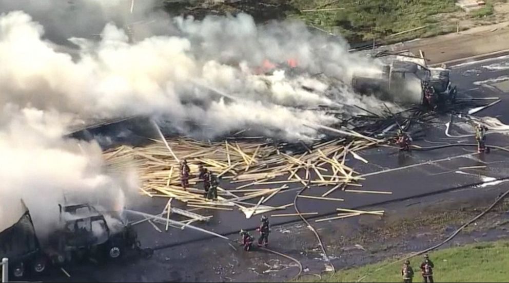 PHOTO: Firefighters battle flames after a fiery crash involving several cars and trucks on the eastbound lanes of Interstate 70 near Denver, April 25, 2019.