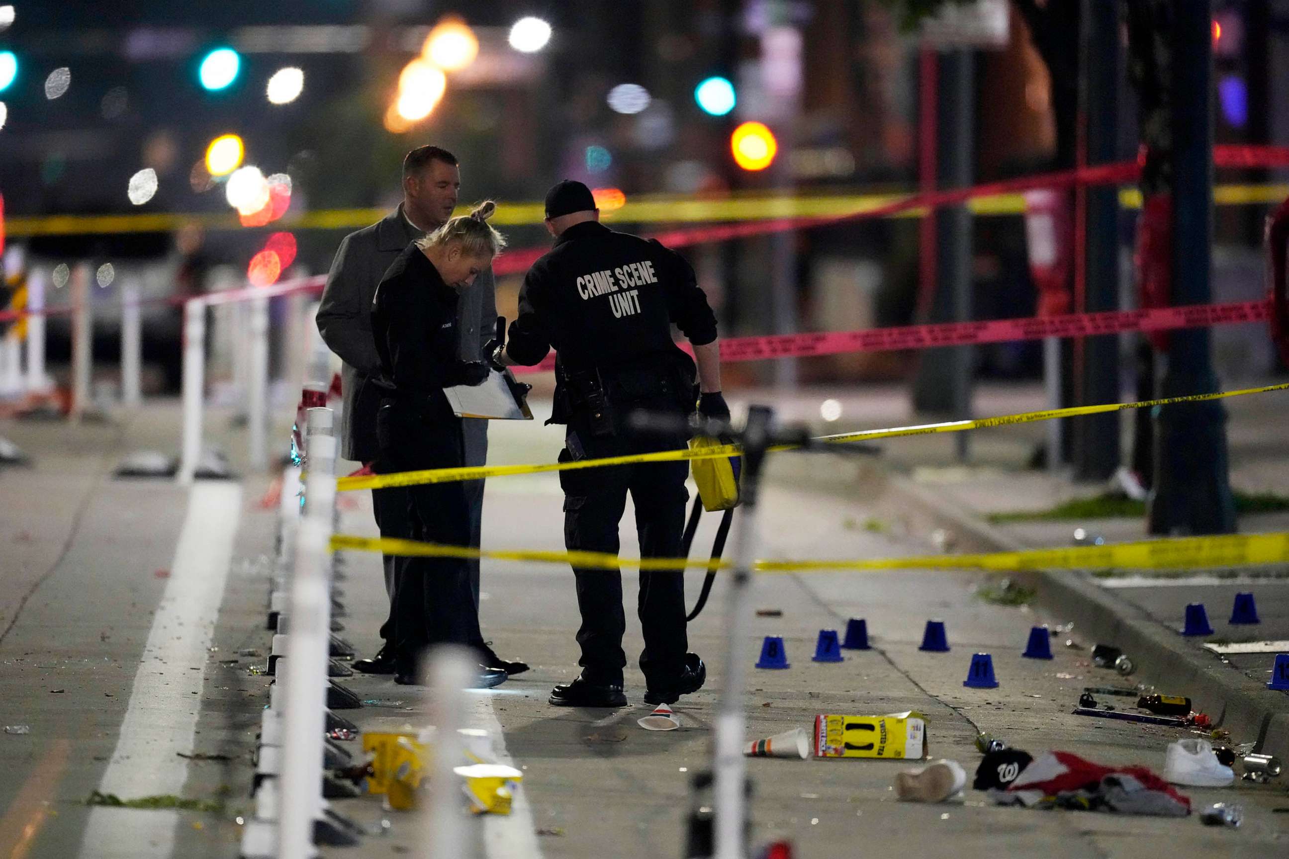 PHOTO: Denver Police Department investigators work on the scene of a mass shooting along Market Street between 20th and 21st avenues during a celebration after the Denver Nuggets won the team's first NBA Championship early, June 13, 2023, in Denver.