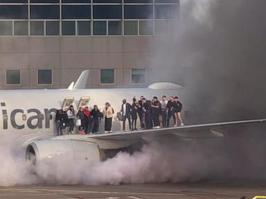 American Airlines flight catches fire at Denver airport