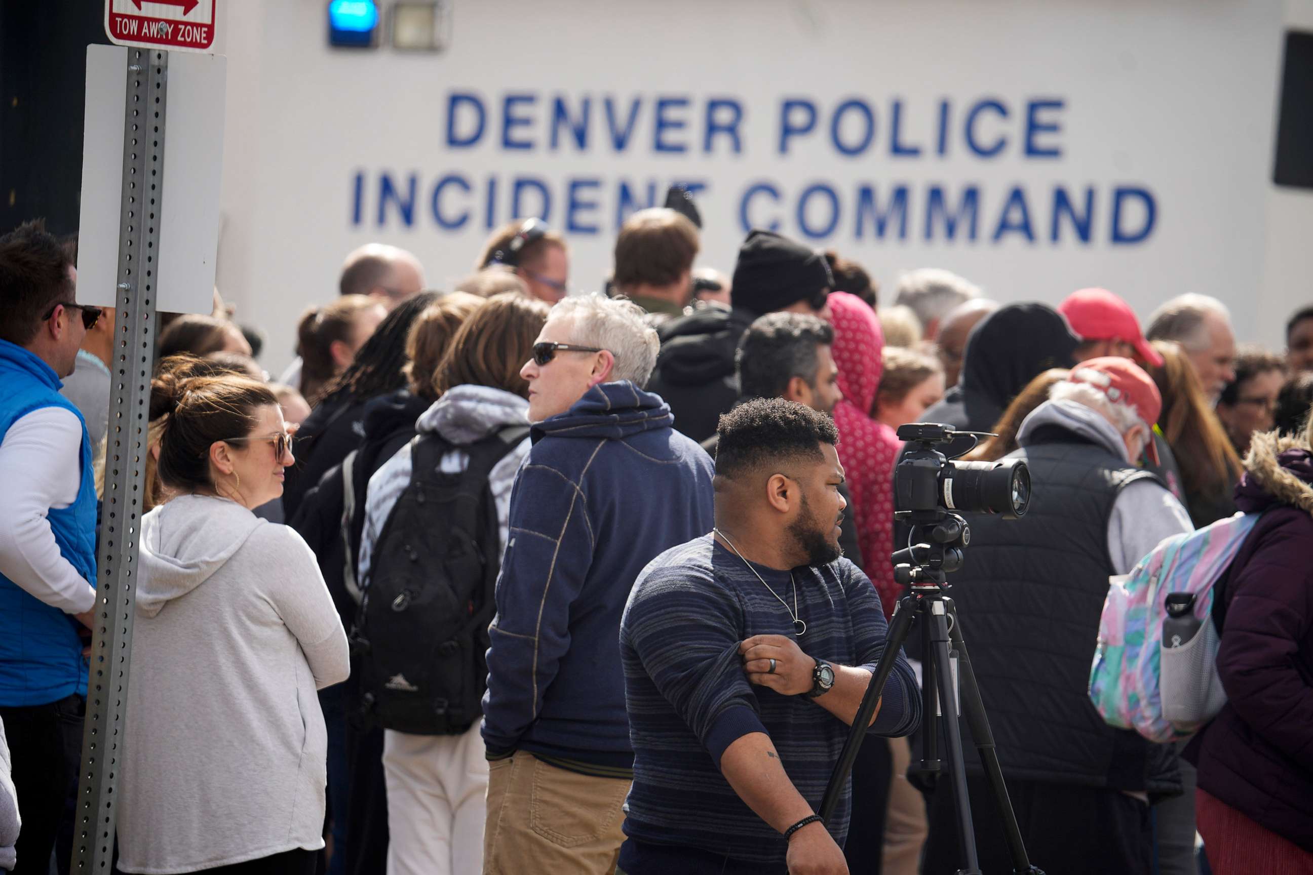 PHOTO: Parents wait for students to be walked out after as shooting at Denver East High School, March 22, 2023, in Denver.
