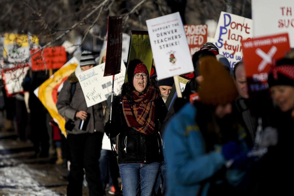 PHOTO: South High School ninth grade teacher Tessa Zatorski, left, chants while picketing outside South High School, Feb. 11, 2019 in Denver.