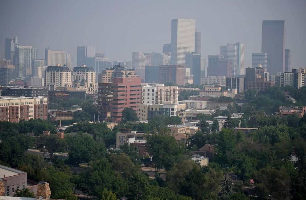 PHOTO: Smoke from western wildfires funnels along Colorado's Front Range and obscures the skyline, Aug. 8, 2021, in Denver.