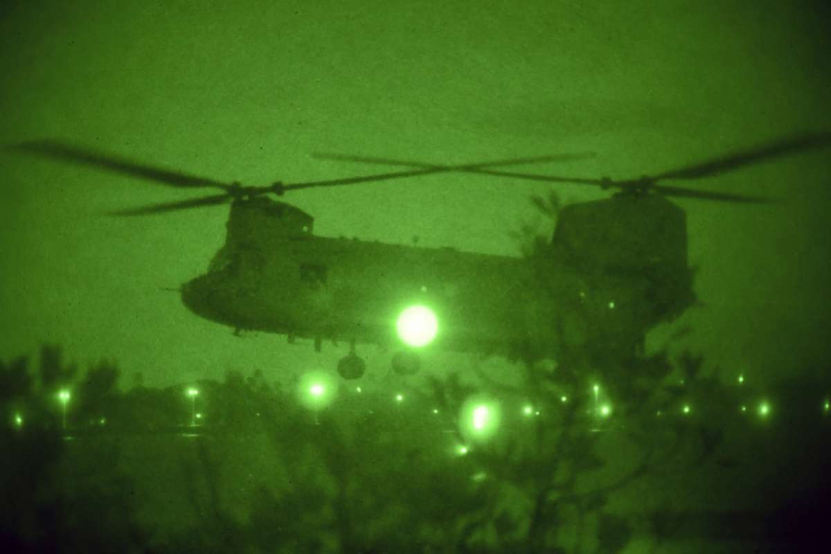 PHOTO: U.S. service members assigned to Naval Special Warfare Command conduct waterborne operations from a CH-47 Chinook helicopter at Pearl Harbor, Hawaii, July 25, 2019.