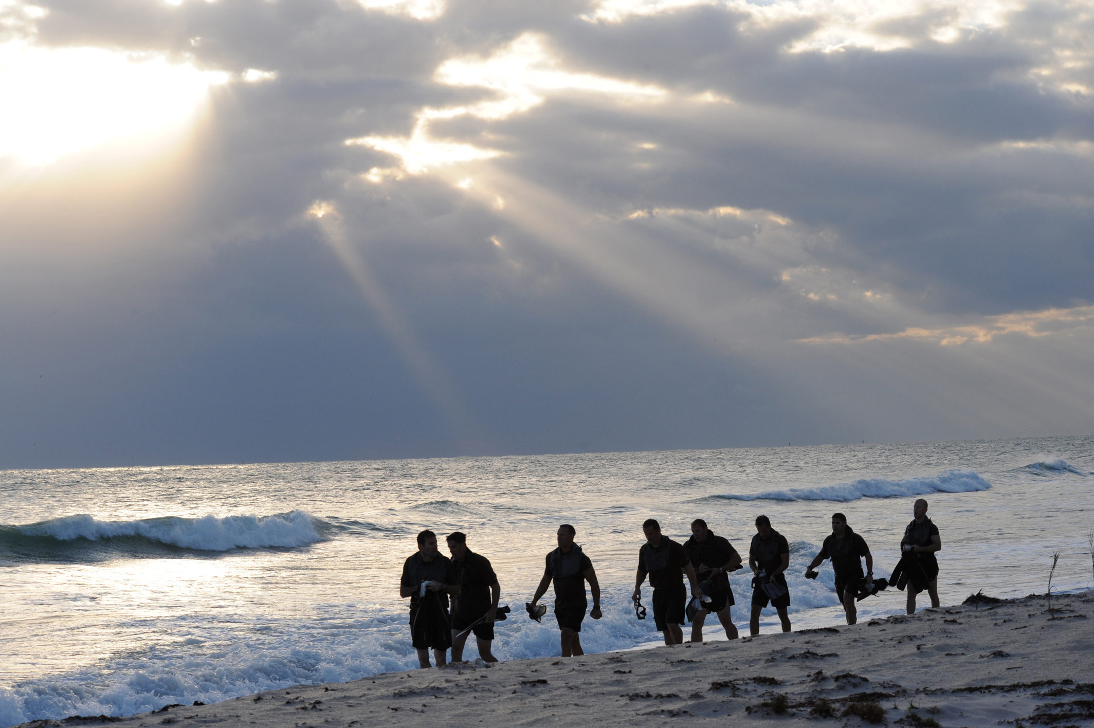 PHOTO: Members of SEAL Team 18 swim into the ocean to release the ashes of fellow SEALs who have died within the last year during a ceremony at Fort Pierce Beach, Fla., Nov. 7, 2010.