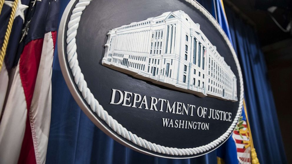 PHOTO: The Department of Justice logo hangs as the backdrop before a press conference in Washington, Aug. 4, 2017.