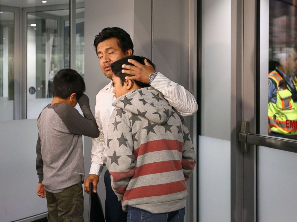 PHOTO: Jesus Lara Lopez, 37, of Willard, Ohio, comforts his sons before he is deported back to Mexico, July 18, at Cleveland Hopkins International Airport.