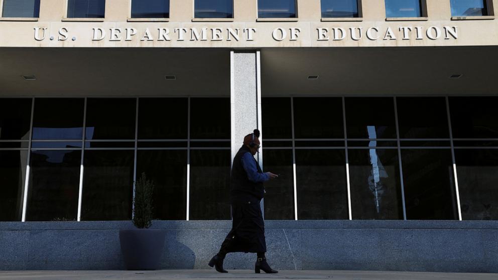 PHOTO: A person walks in front of the Department of Education building, amid reports that U.S. President Donald Trump's administration will take steps to defund the federal Education Department, in Washington, Feb. 4, 2025.