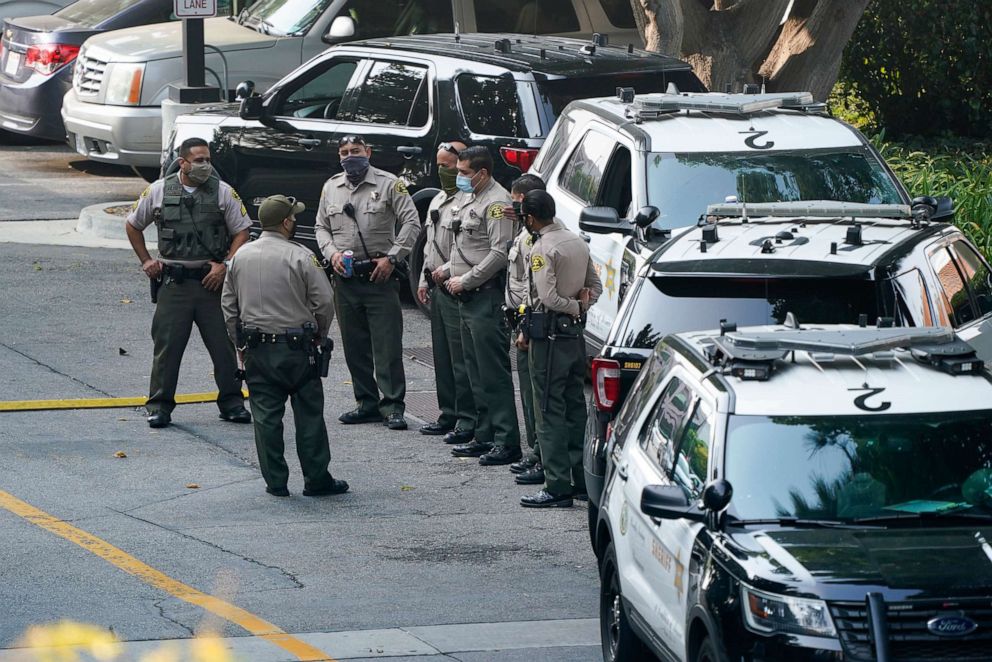 PHOTO: Police officers stand outside St. Francis Medical Center on Sept. 14, 2020, in Lynwood, Calif. Two Los Angeles County Sheriff's deputies were shot in an apparent ambush Saturday.