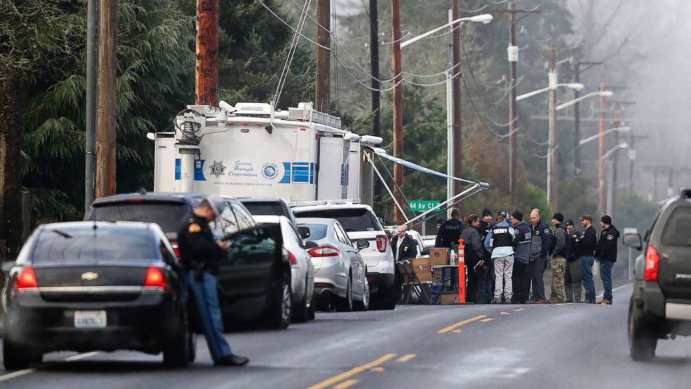 Pierce County Sheriff and other law enforcement officials gather, Jan. 8, 2018, in Frederickson, Wash., near the scene of the fatal shooting of a Pierce County Sheriff's deputy.