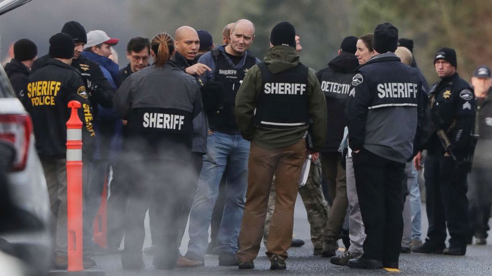 Pierce County Sheriff and other law enforcement officials gather, Jan. 8, 2018, in Frederickson, Wash., near the scene of the fatal shooting of a Pierce County Sheriff's deputy.