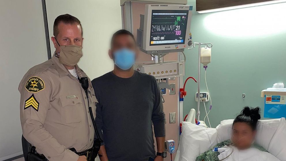 PHOTO: Sgt. Frederickson, from the Los Angeles County sheriff's office, visits a female deputy who was shot during an ambush as seen in photo posted in the Lost Hills Sheriff's Station Facebook account. The injured deputy's husband is also pictured.