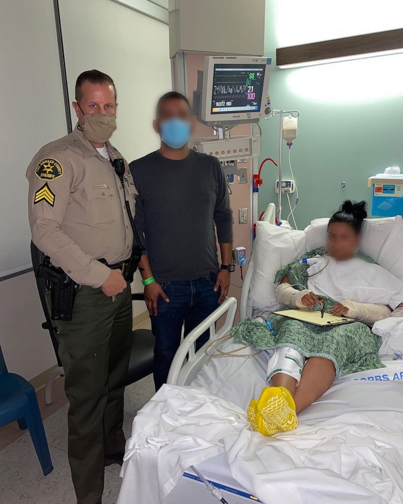 PHOTO: Sgt. Frederickson, from the Los Angeles County sheriff's office, visits a female deputy who was shot during an ambush as seen in photo posted in the Lost Hills Sheriff's Station Facebook account. The injured deputy's husband is also pictured.