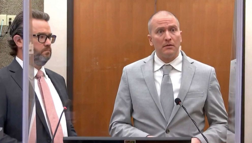 PHOTO: In this image taken from video, former Minneapolis police Officer Derek Chauvin, accompanied by defense attorney Eric Nelson, addresses the court during his sentencing proceedings on June 25, 2021, at the Hennepin County Courthouse in Minneapolis.