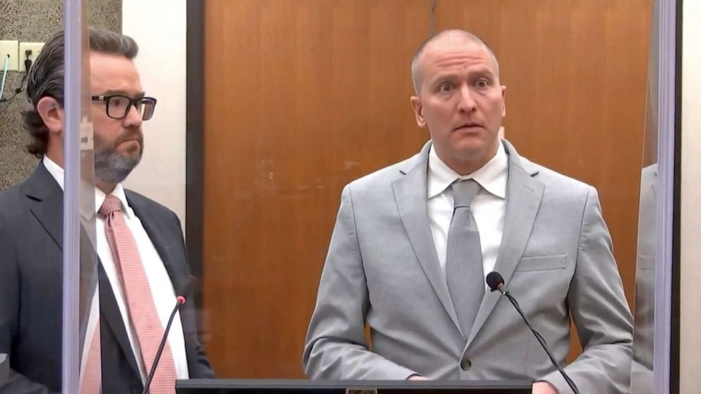 PHOTO: Former Minneapolis police Officer Derek Chauvin, accompanied by defense attorney Eric Nelson, addresses the court during his sentencing proceedings on June 25, 2021, at the Hennepin County Courthouse in Minneapolis.