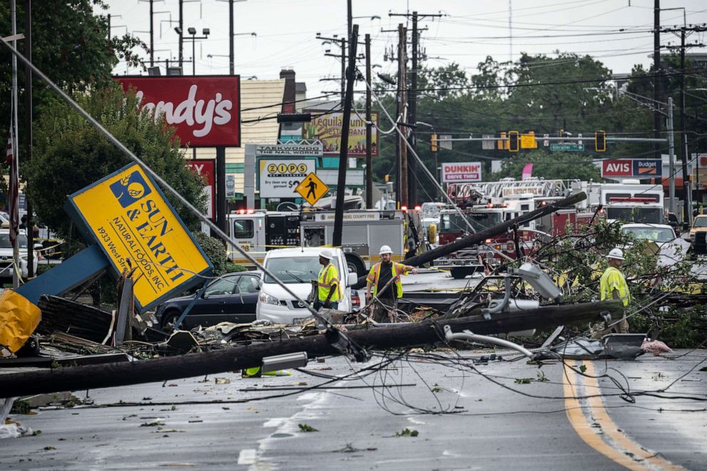 PHOTO: Comcast utility workers survey the damage from a tornado on West Street in Annapolis, Md., Sept. 1, 2021. 