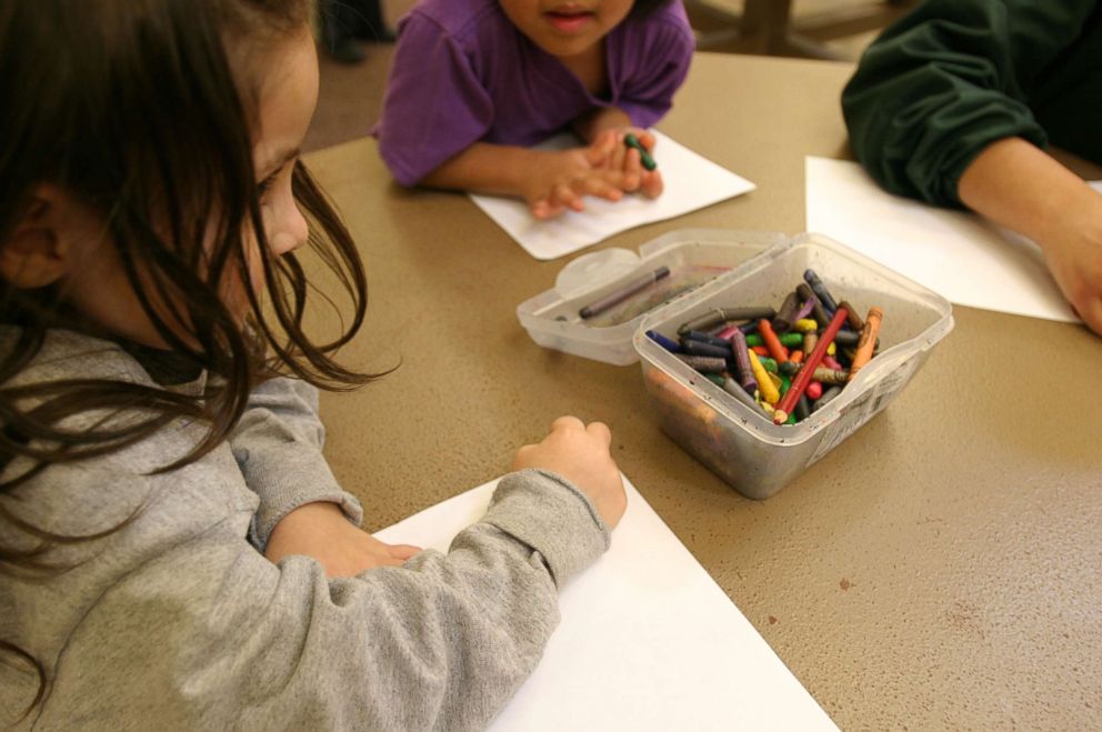 PHOTO: Children of immigrant families color at the T. Don Hutto Residential Center in Taylor, Texas.