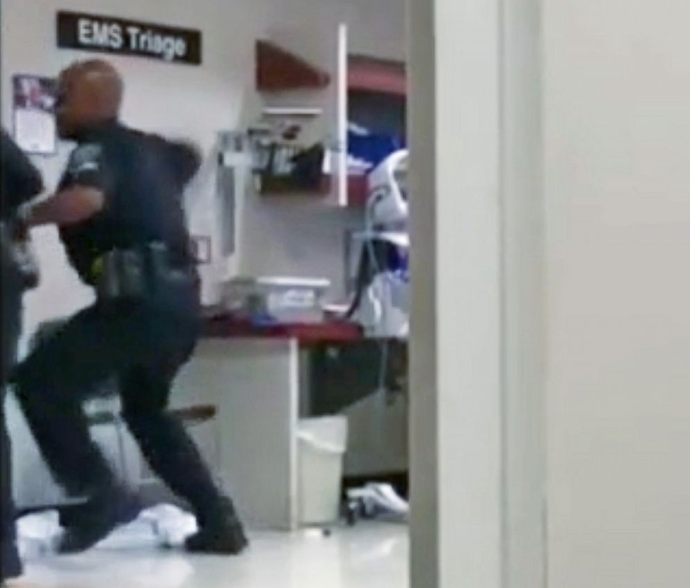 PHOTO: An image made from cell-phone video appears to show a Detroit police officer punching a naked and apparently emotionally disturbed woman at Detroit Receiving Hospital, Aug. 1, 2018. 