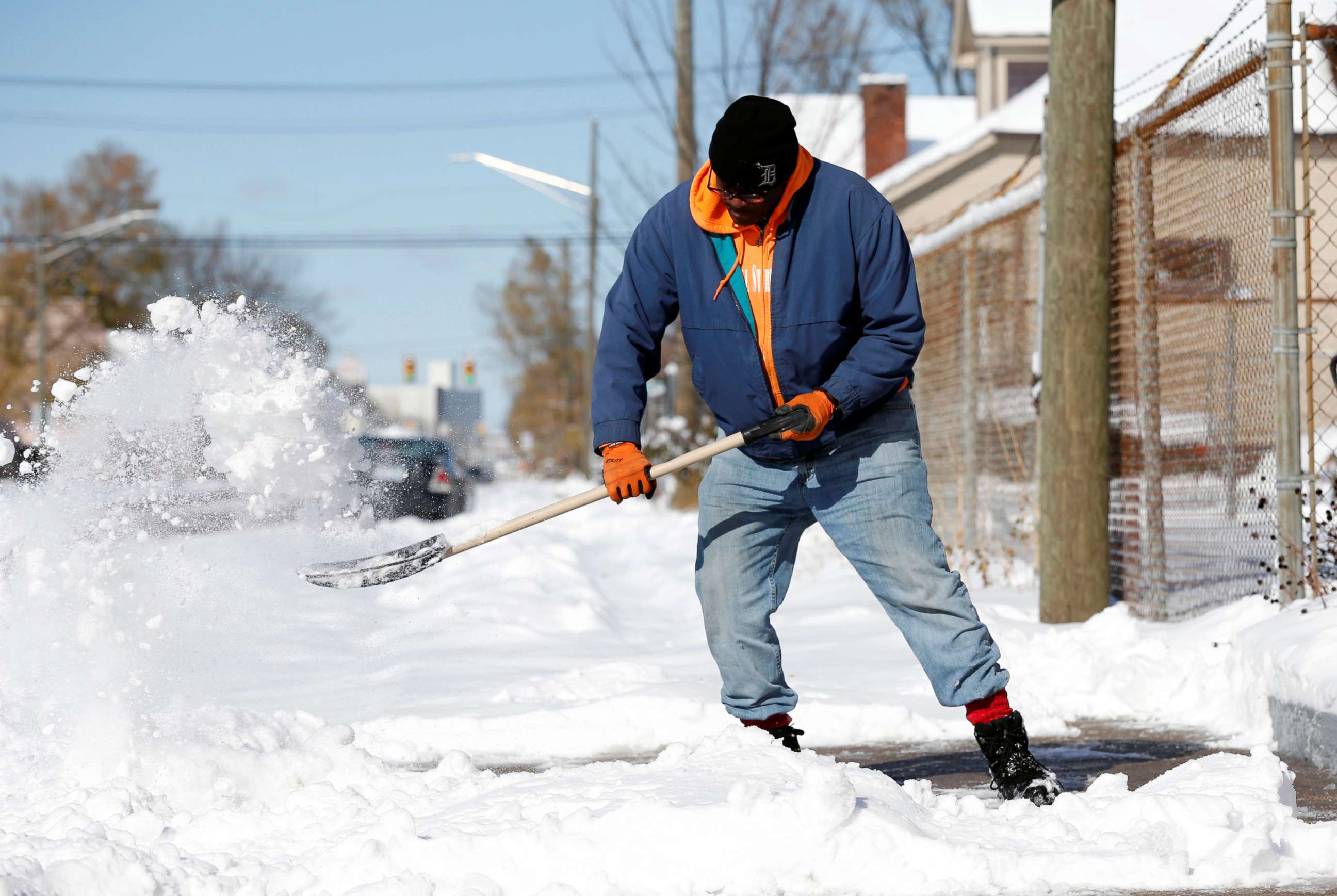 PHOTO: Kevin Strickland shovels snow from a sidewalk in Detroit, Michigan, Nov. 12, 2019.