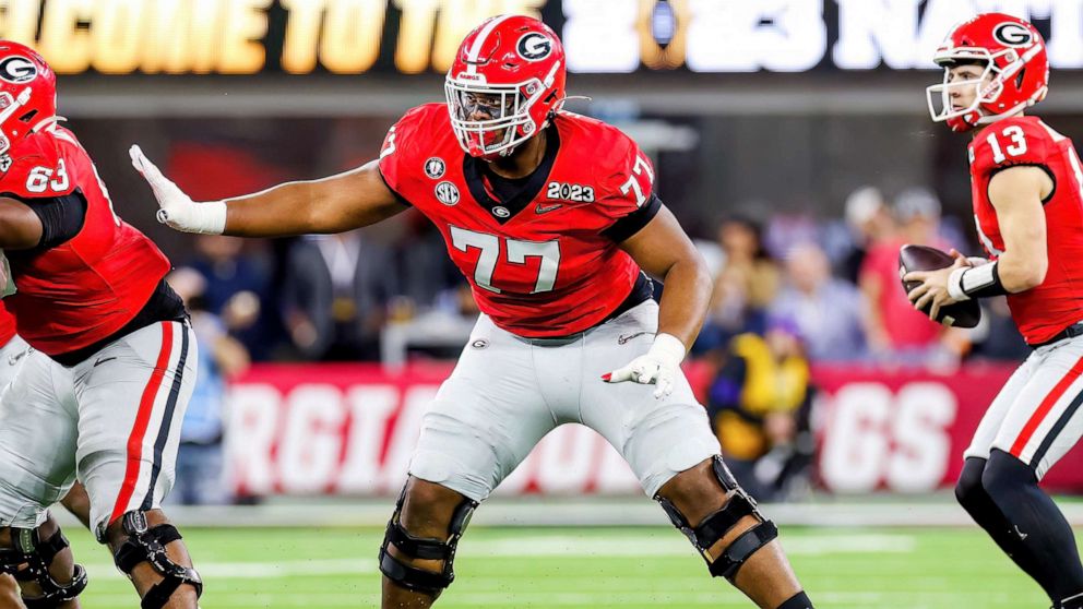 PHOTO: Georgia Bulldogs offensive lineman Devin Willock (77) looks to block during the College Football Playoff National Championship game between the TCU Horned Frogs and the Georgia Bulldogs on Jan. 9, 2023 at SoFi Stadium in Inglewood, Calif.