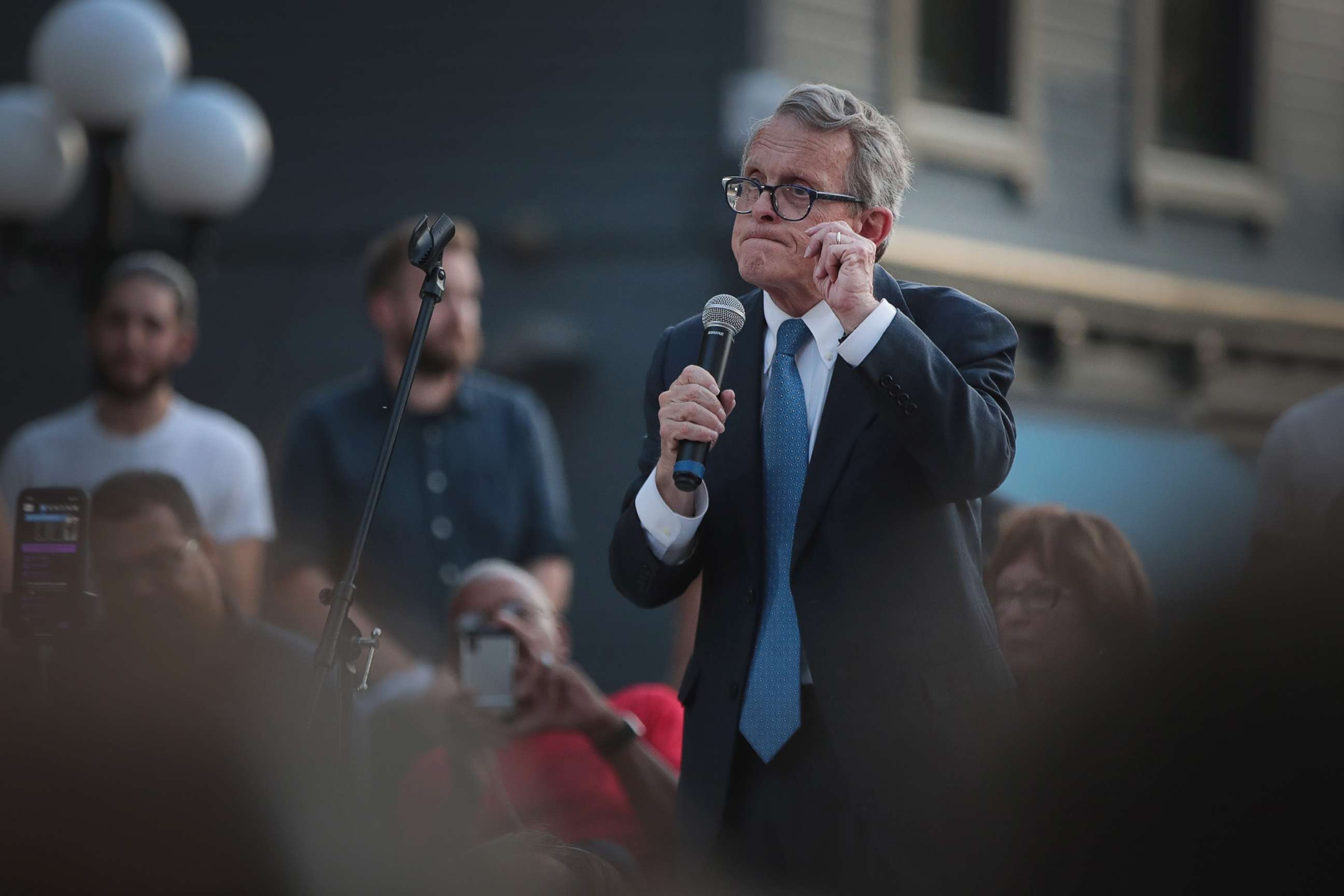 PHOTO: Ohio Governor Mike DeWine speaks to mourners at a memorial service in the Oregon District held to recognize the victims of an early-morning mass shooting in the popular nightspot, Aug. 4, 2019, in Dayton, Ohio. 