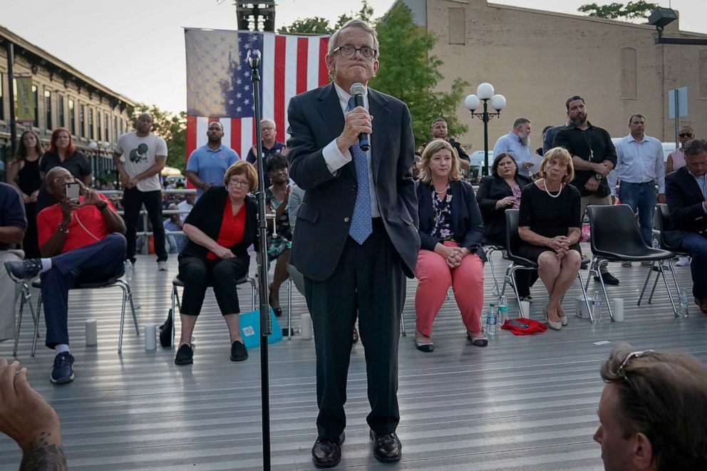 PHOTO: Ohio Governor Mike DeWine reacts as vigil attendees shout, "Do Something" while he was speaking at a vigil at the scene after a mass shooting in Dayton, Ohio, Aug. 4, 2019.